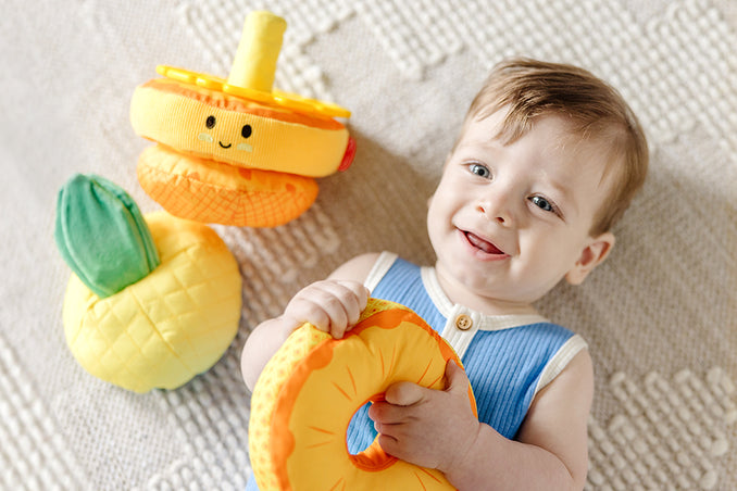 Baby with Melissa & Doug Pineapple Soft Stacker toy